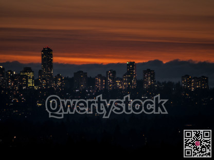 City lights after sunset on darker sky background