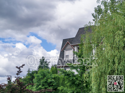 Top of residential building with window on the roof