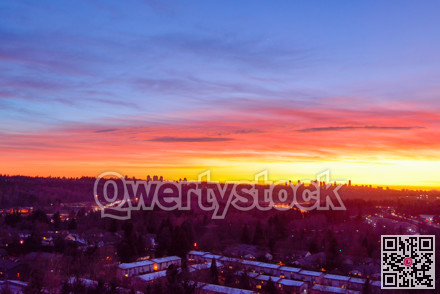 Suburban residential area on sunset sky background