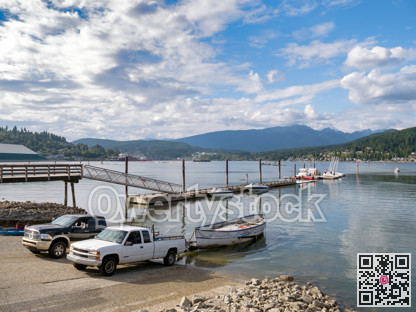 Boat towing tracks with trailers on Port Moody inlet