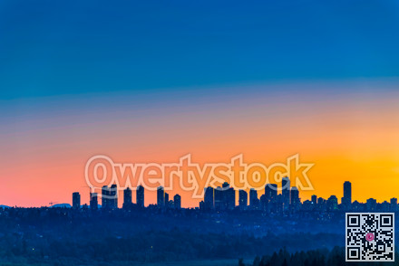 Metrotown district on late sunset sky background