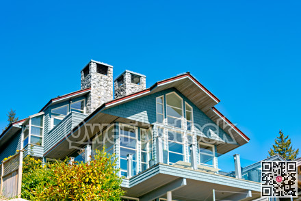 Top of residential house with patio on blue sky background