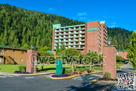 Sand shore of the lake leading to resort building