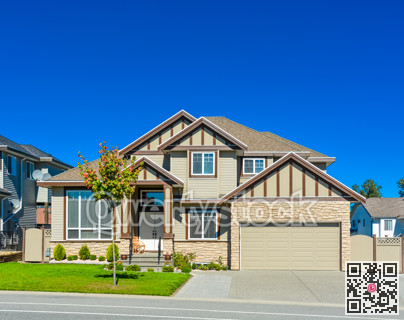 Big family house with concrete driveway and wide garage door