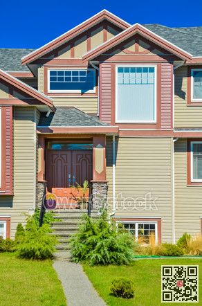 Main entrance of big family house with concrete door steps in front