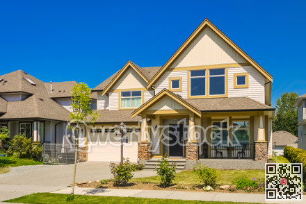 Big family house with concrete driveway to the garage