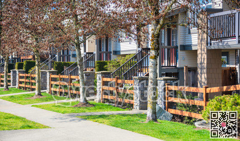 Wooden front yard fence and entrnace of residential townhouses