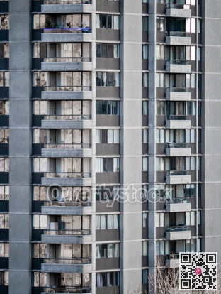 Facade of residential high-rise towers on bright sunny day