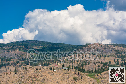 Summer mountains landscape on cloudy sky background