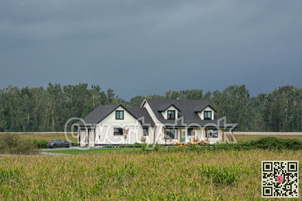 Brand new farmer's house in the middle of corn field