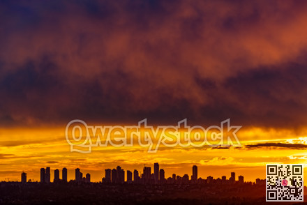 Metrotown on sunset cloudy sky background closer to the night