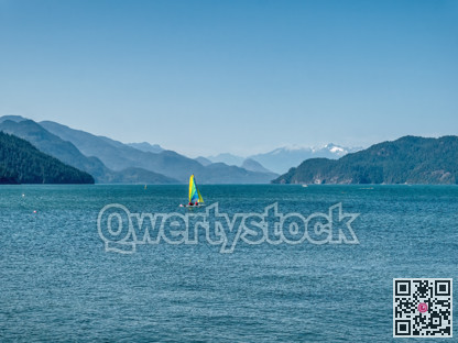 Beautiful view over Harrison lake with sail yacht on the water