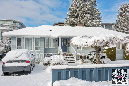 Winter street overview with residential house and apartment buildings