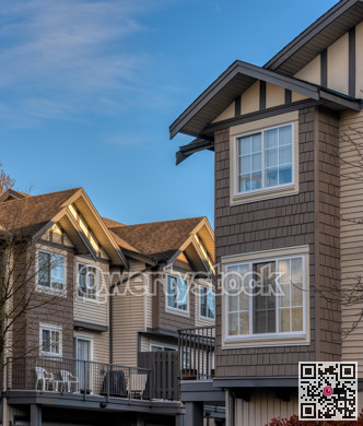 Neigbourhood of residential townhouses in light of golden sunset