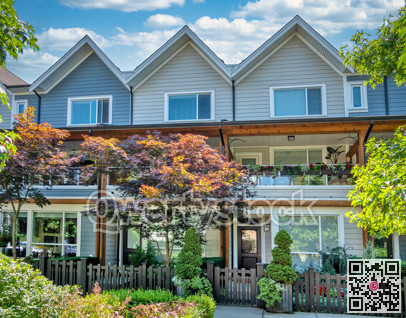 A row of residential townhouses on summer sunny day