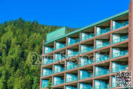 Resort building facade on mounting and blue sky background