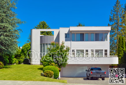 Modern residential house with car parked on driveway in front