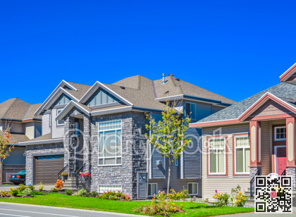 Suburban family house with green lawn in front