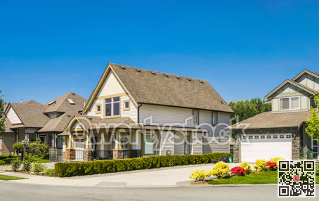 Big family house with concrete driveway to the garage