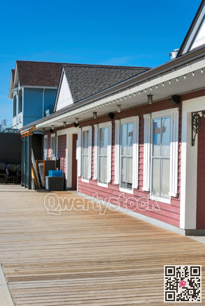 Wood plank pavement in front of office building on sunny day
