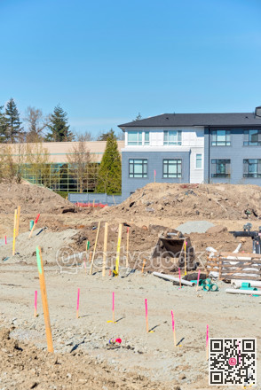Construction zone with new building development on blue sky background