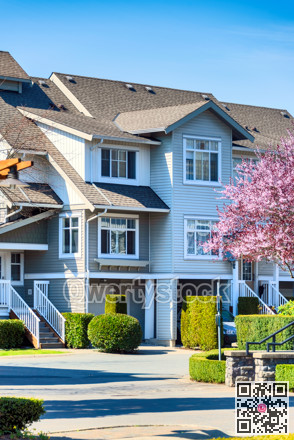 Residential townhouse building on spring sunny day