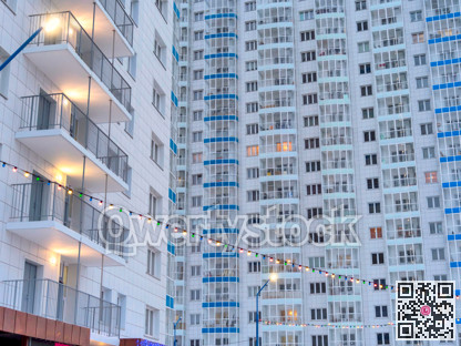 Facade of high-rise residential buildings on winter day at holiday season
