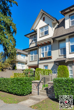 Paved pathway to the entrance of residential townhouse