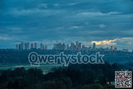 Overview of Metrotown cityscape on cloudy sky background