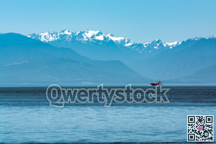 Freight vessel going over the bay on Pacific ocean at Vancouver island