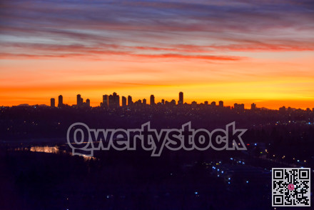Urban and suburban residential area on sunset sky background